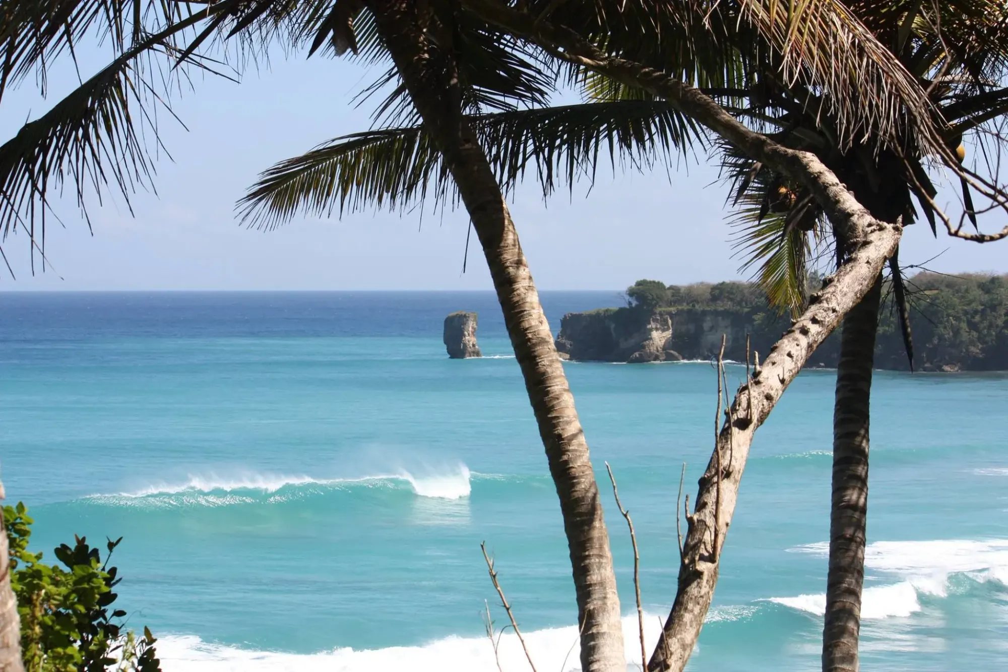 Empty, crystal clear waves along the dramatic coastline of the Dominican Republic