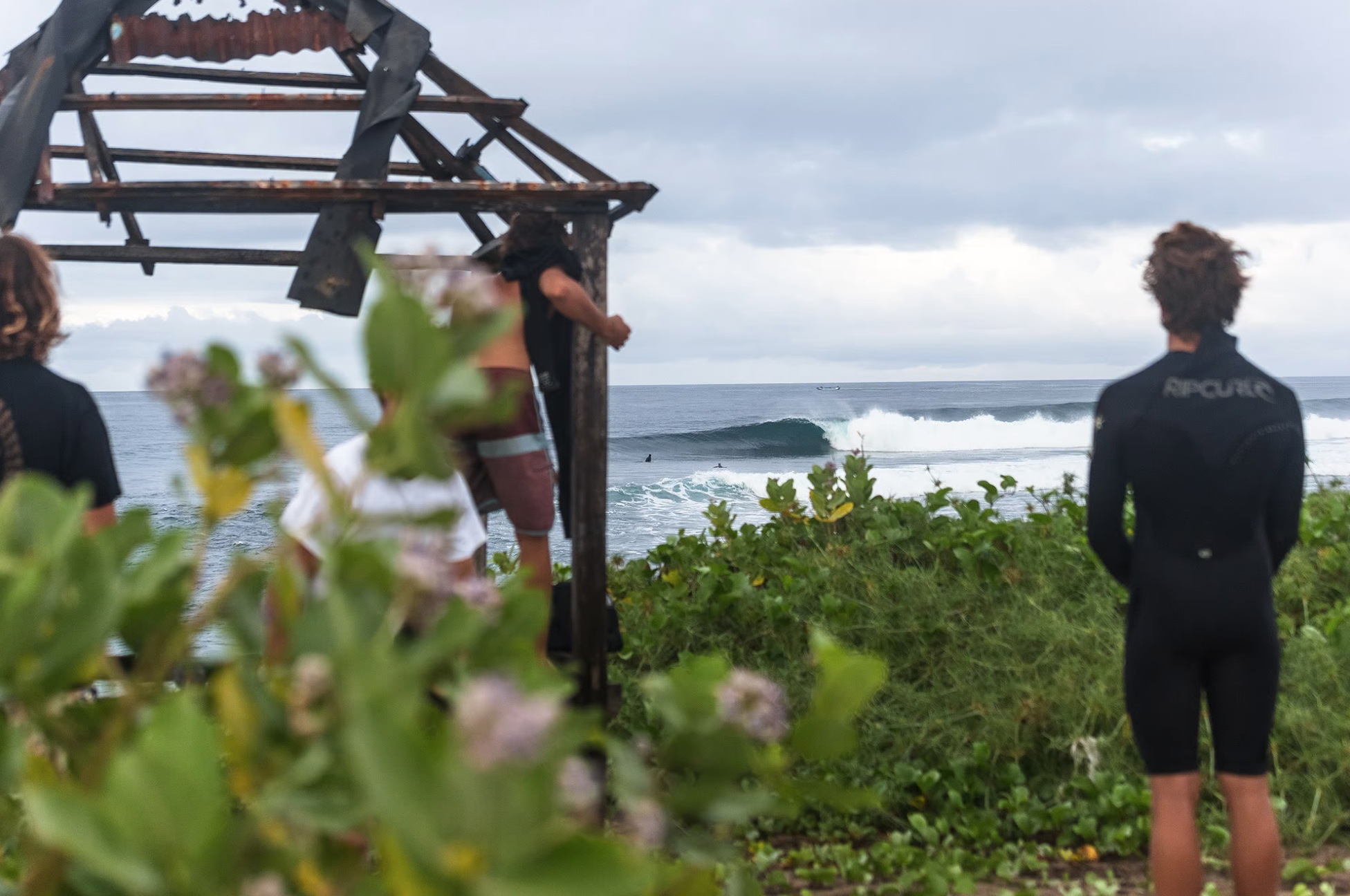 Surfers looking at a righthand point in Sumbawa