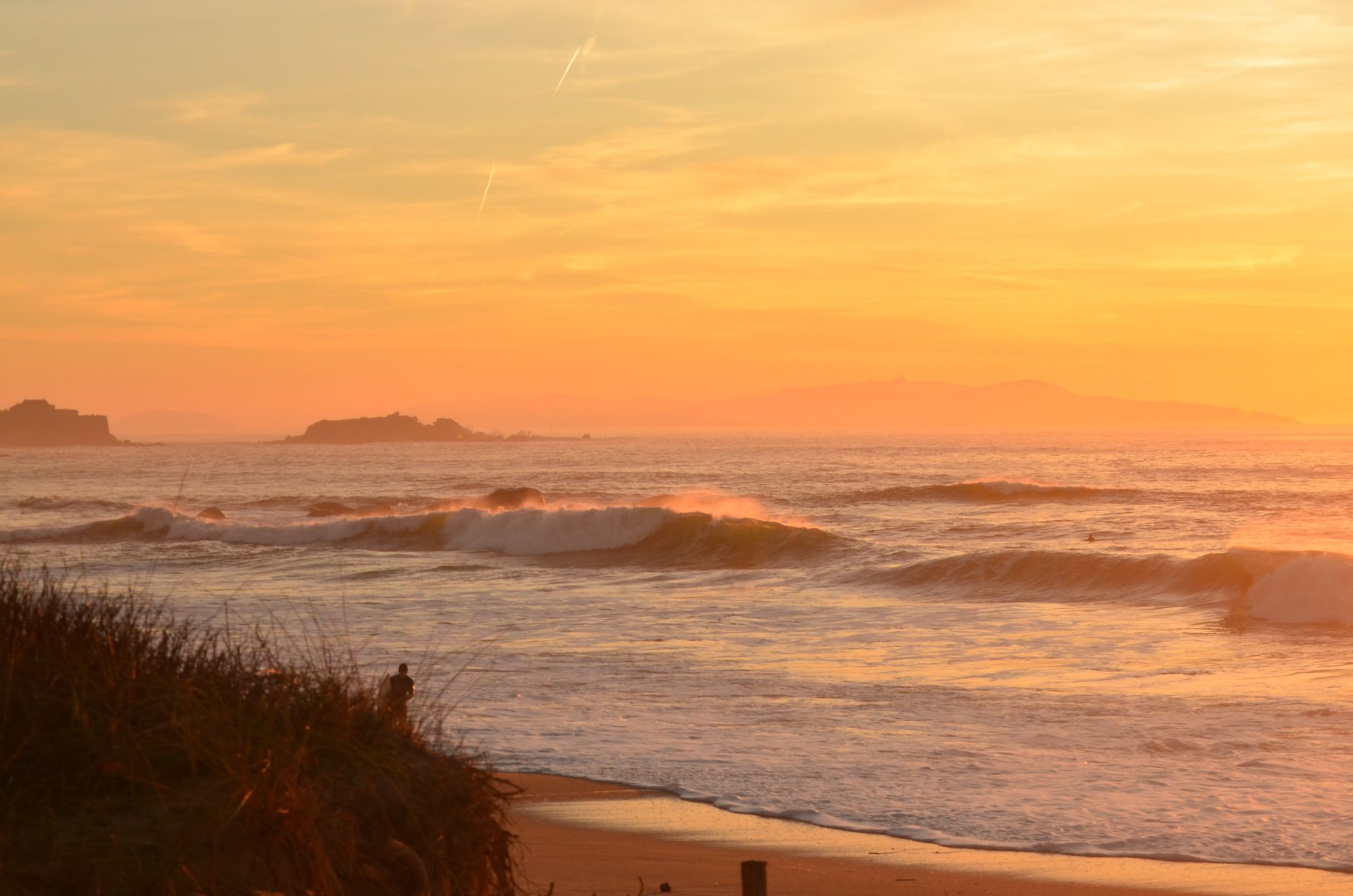 A beautiful sunset at a surf spot in Galicia, Spain