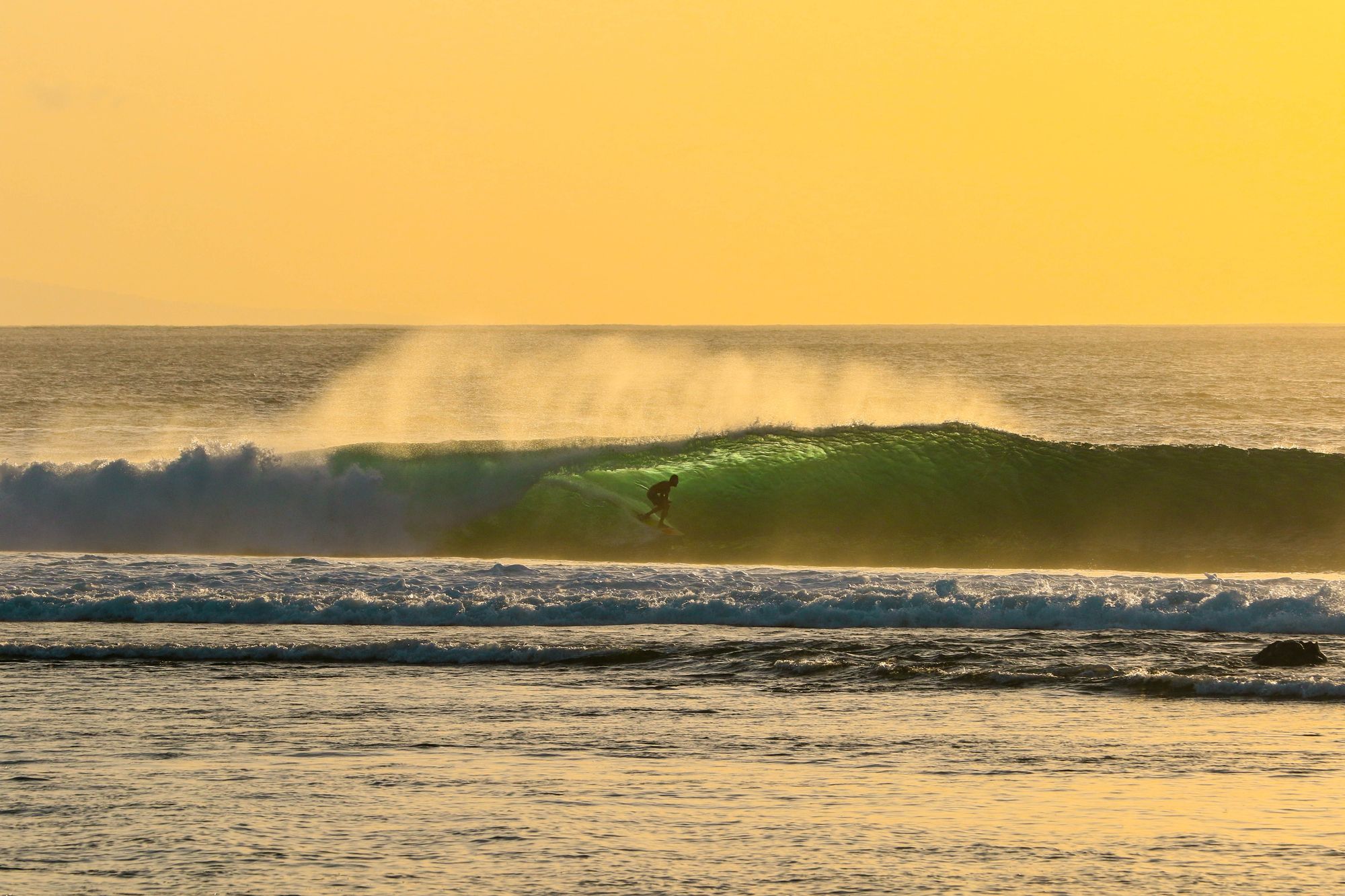 surfer getting barreled in Lombok, Indonesia