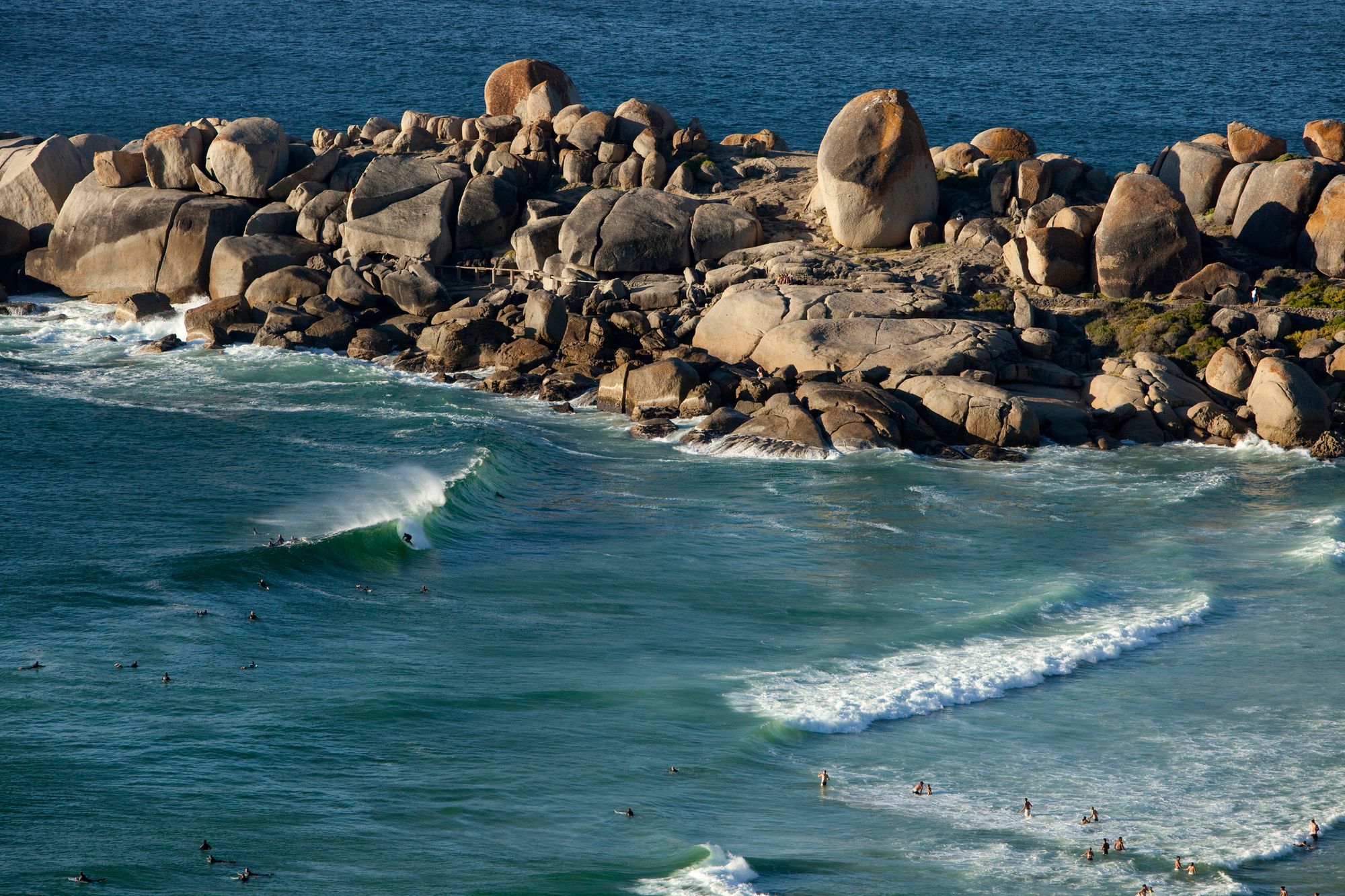 aerial view of a surfer getting barreled in Cape Town, South Africa, one of the best surf spots for June