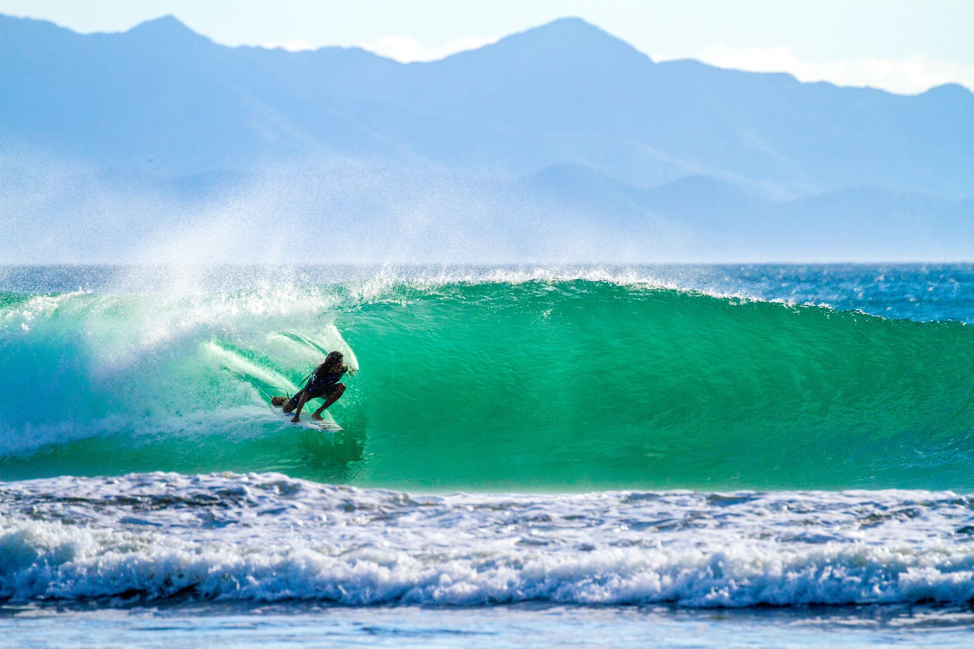 surfer in nicaragua, oneof the cheapest surf destinations