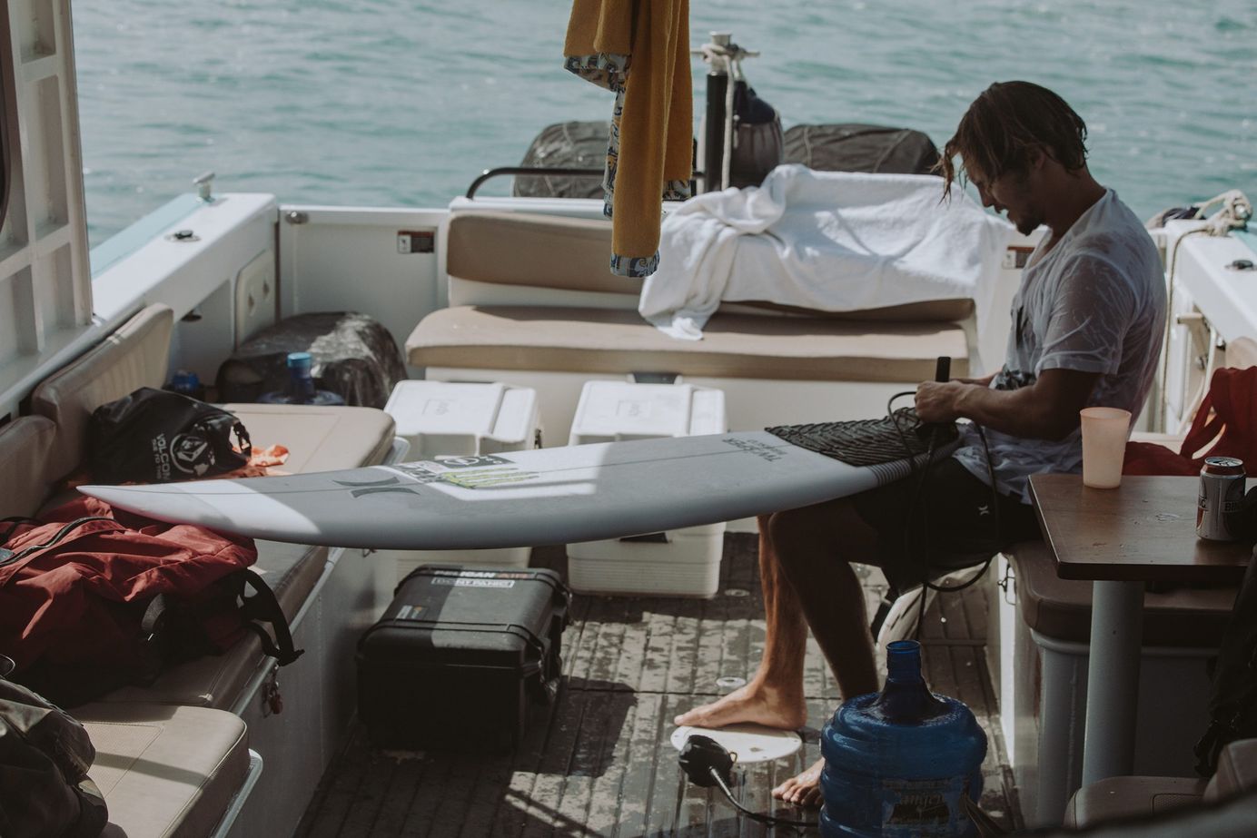 Portuguese big wave surfer Nic von Rupp preps his surfboard on a trip to Indonesia to surf Greenbush